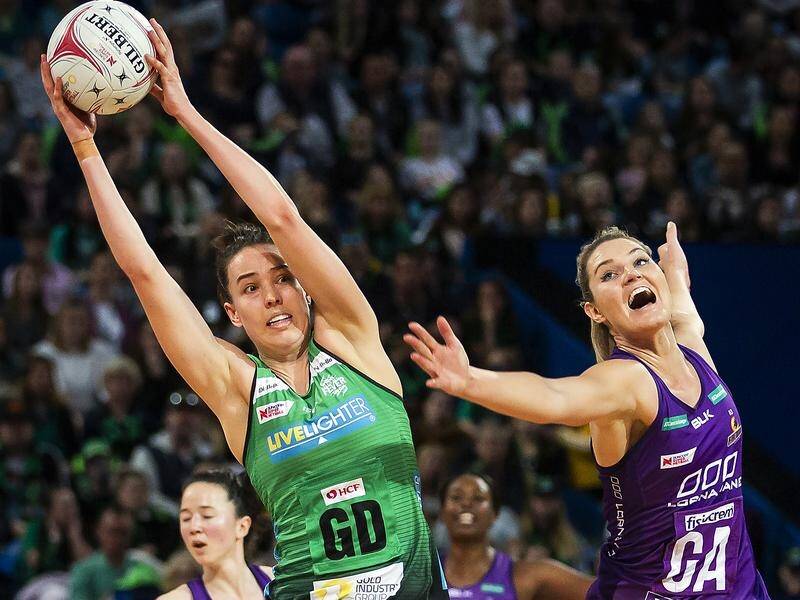 The Fever's Shannon Eagland wins possession from Gretel Tippett but the Firebirds won 69-57.