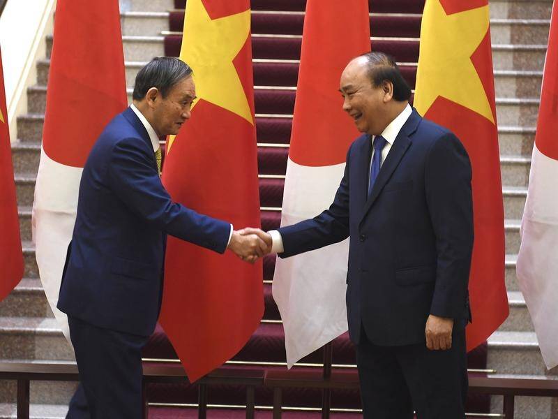 Japan's Prime Minister Yoshihide Suga, left, with Vietnam's Prime Minister Nguyen Xuan Phuc.