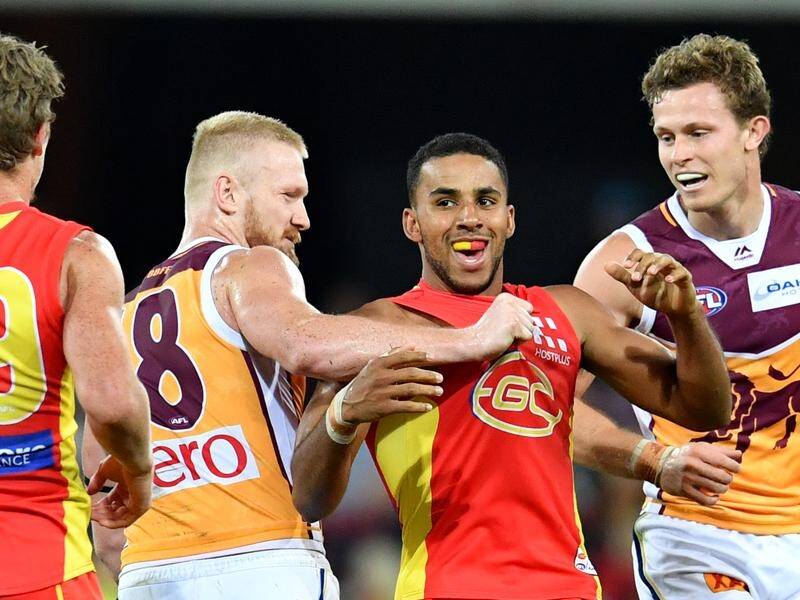 Gold Coast's Touk Miller (2nd from right) is set to resume hostilities with Brisbane in the QClash.