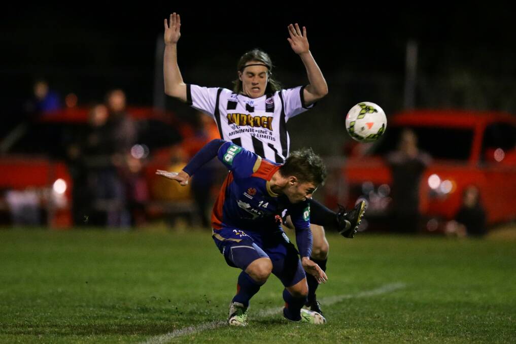 IMPORT: Newcastle Jets recruit striker Jeronimo Neumann scores in front of Weston Bears player Jacob Golding at a trial match between the two clubs.