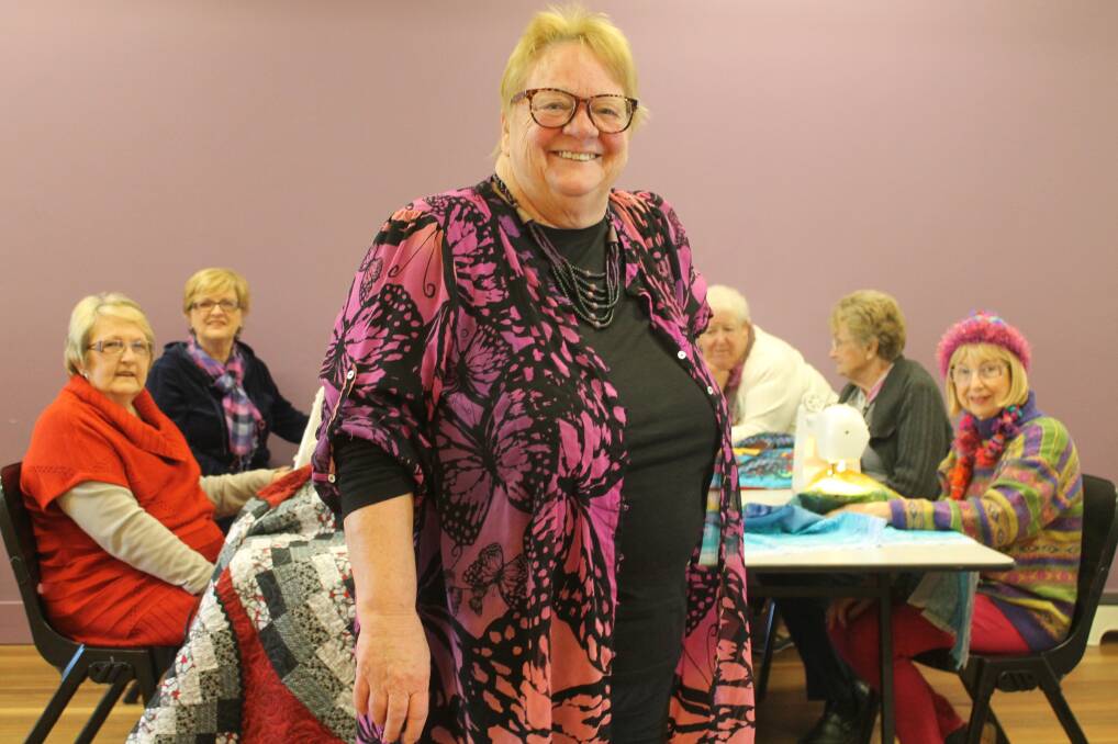 STUNG: Swansea Community Cottage managing committee secretary Sue Thornton with the patchwork group.