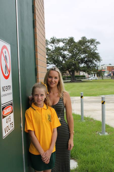 RELIEF: Adamstown resident Brooke Hirst with her daughter Tahlia, 10, at the Glebe Road pumping station. Picture: Kim-Cherie Davidson