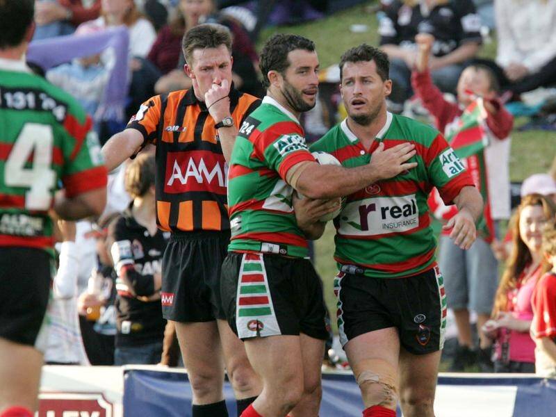 Pictured in 2006 during their playing days, Ben (right) and Shane Walker want to coach the Titans.