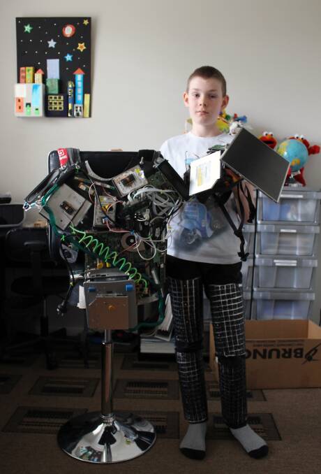 11-year-old Lucas Allan, of Holmesville, with his homemade "superhero armor suit" made of recycled computer parts. Lucas will enter his project in West Wallsend District Sustainable Neighbourhood Group's Old Waste New Art competition.