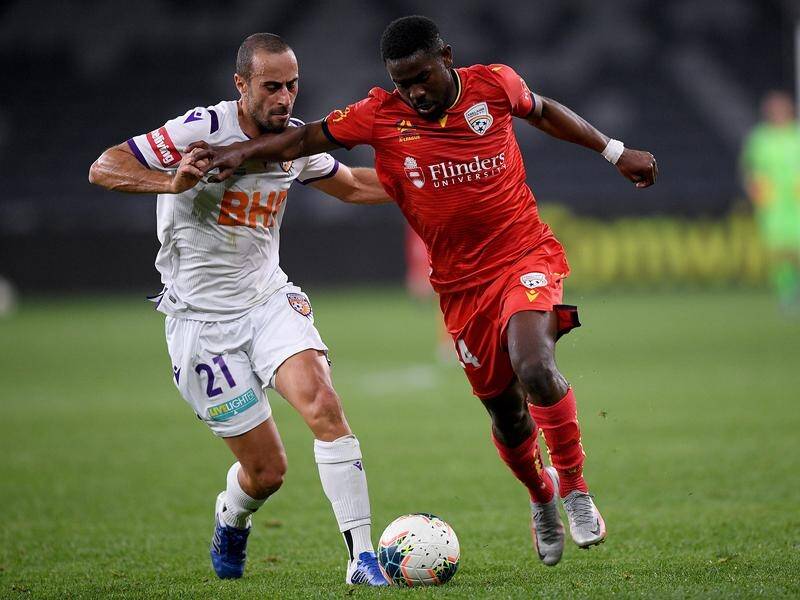 Pacifique Niyongabire of United competes for possession with Tarek Elrich of the Glory.