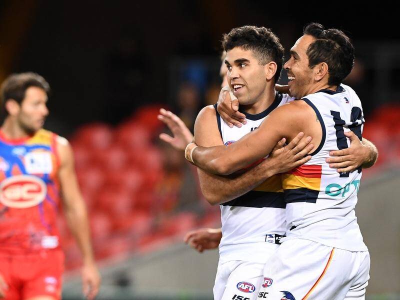 Eddie Betts (R) has kicked six goals for Adelaide in a 95-point AFL flogging of hapless Gold Coast.
