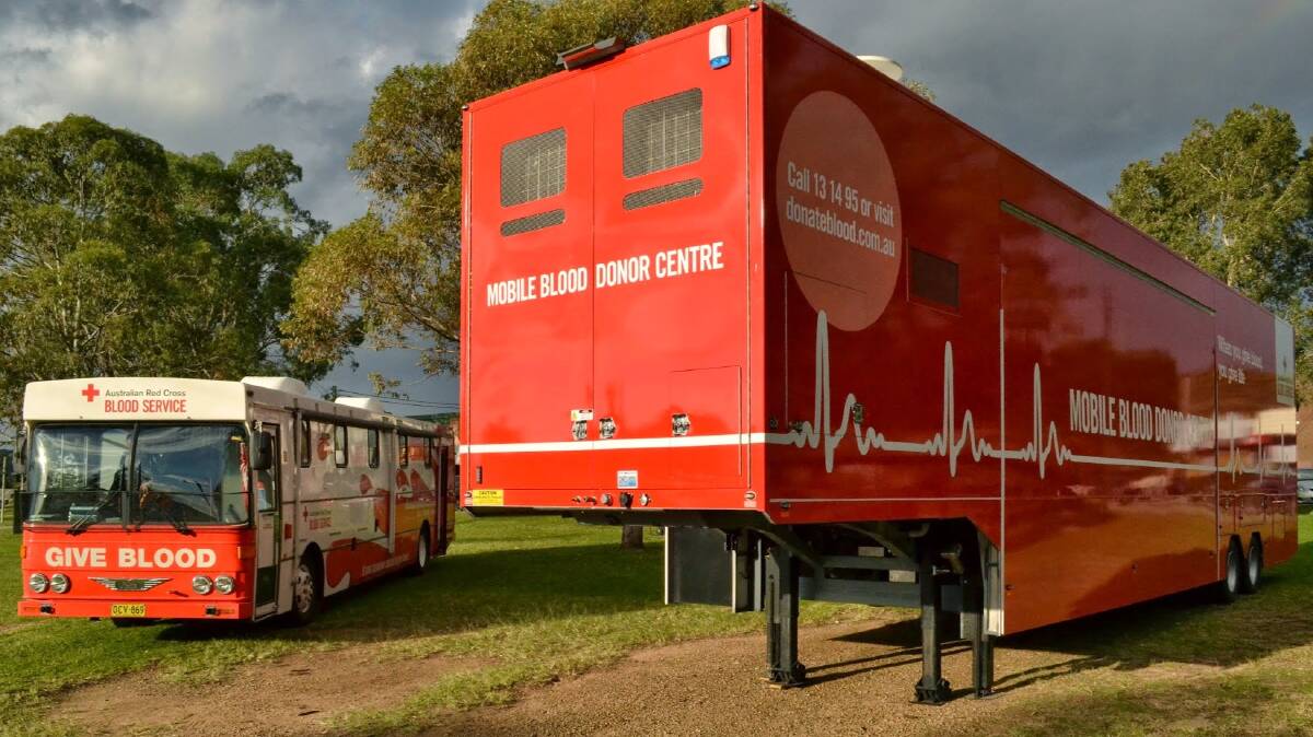 The new Australian Red Cross Blood Service mobile unit next to the bus it replaced.