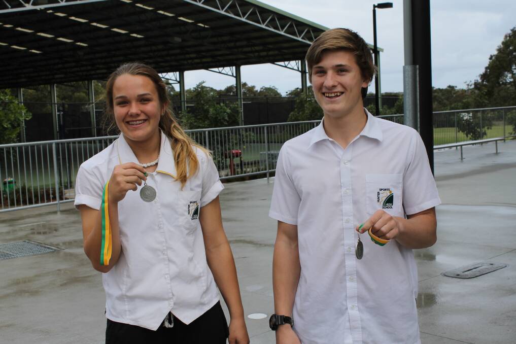 WELL DONE: Hunter Sports High year 10 students Emma-Sue Greentree and Matt Cooper with their sports awards.