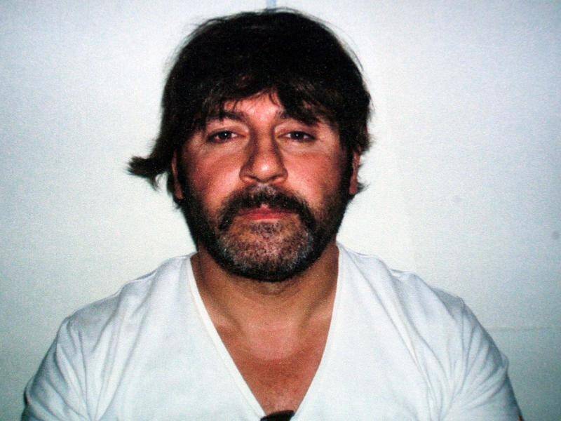 Tony Mokbel seen wearing a wig at the time of his arrest in an Athens cafe in June 2007.