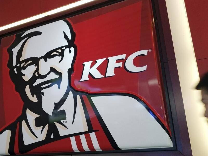 KFC has apologised for an advertisment that depicts two young boys staring at a woman's breasts.