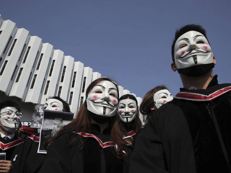 University students wear Guy Fawkes masks during a protest at the Chinese University of Hong Kong.