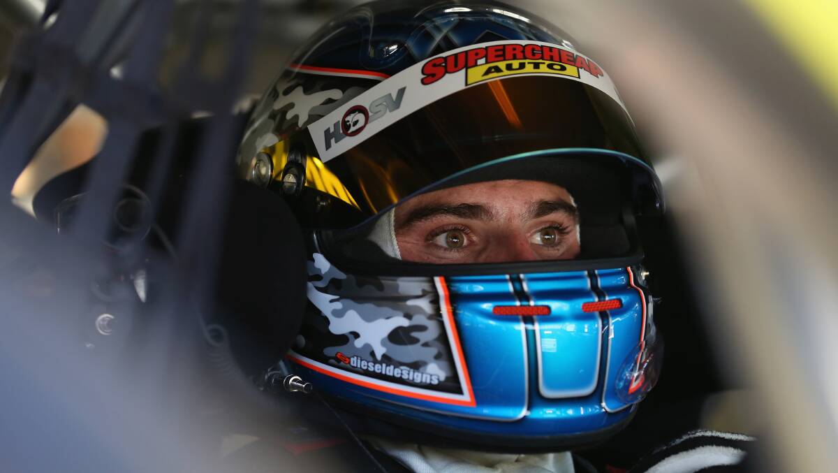 Tim Slade driver of the #47 Supercheap Auto Racing Holden sits in his car prior to practice for the Clipsal 500 which is round one of the V8 Supercar Championship Series at the Adelaide Street Circuit. Picture: Getty
