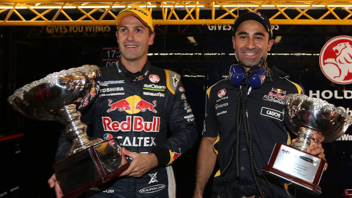 Jamie Whincup driver the #1 Red Bull Racing Australia Holden celebrates with engineer David Cauchi after winning race one of the V8 Supercar Championship Series in Adelaide. Picture: Getty