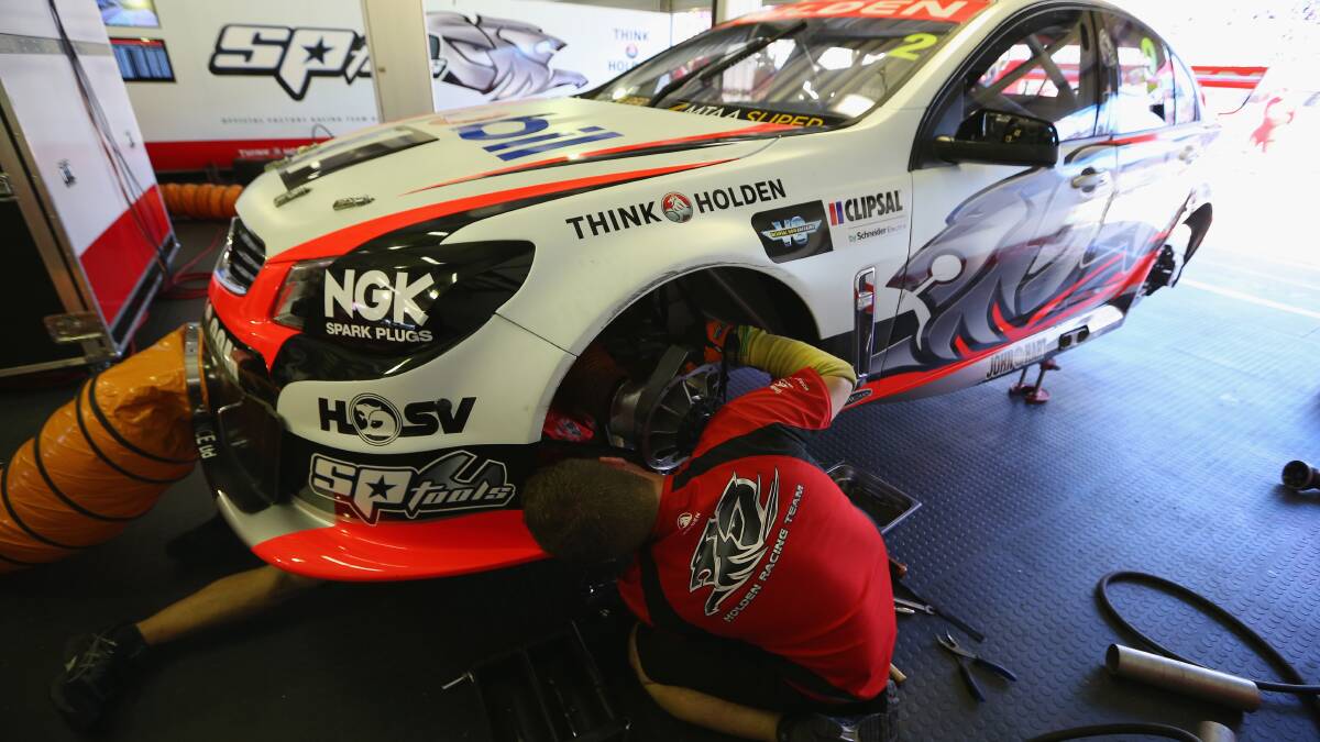The #2 Holden Racing Team Holden of Garth Tander is repaired after it hit the wall during practice for the Clipsal 500. Picture: Getty