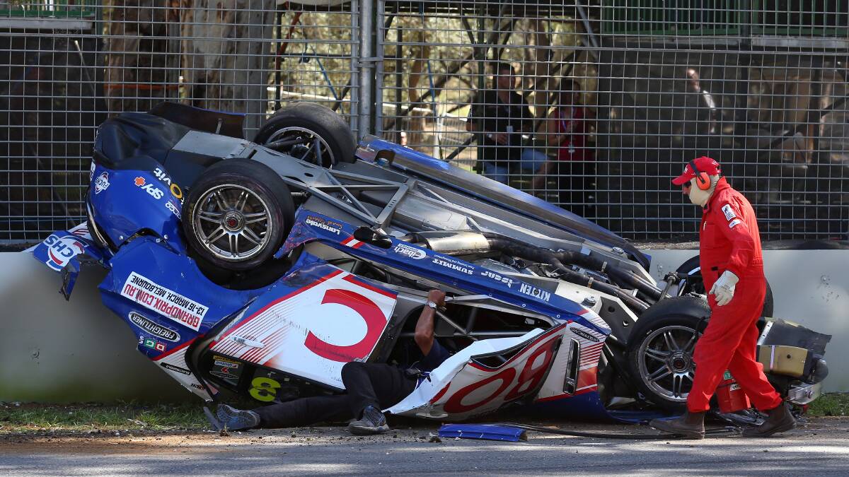 Clipsal 500 action as the #8 Team BOC Holden of Jason Bright flips on to its roof after a rollover during race three of the V8 Supercars Championship Series. Picture: Getty