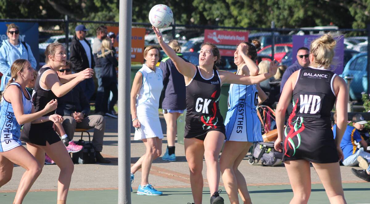 ON THE BALL: Kimberley Goodearl, one of the lynchpins of Wests' dominant undefeated season, gathers up a rebounded shot against Forsythes. Picture: Isaac McIntyre