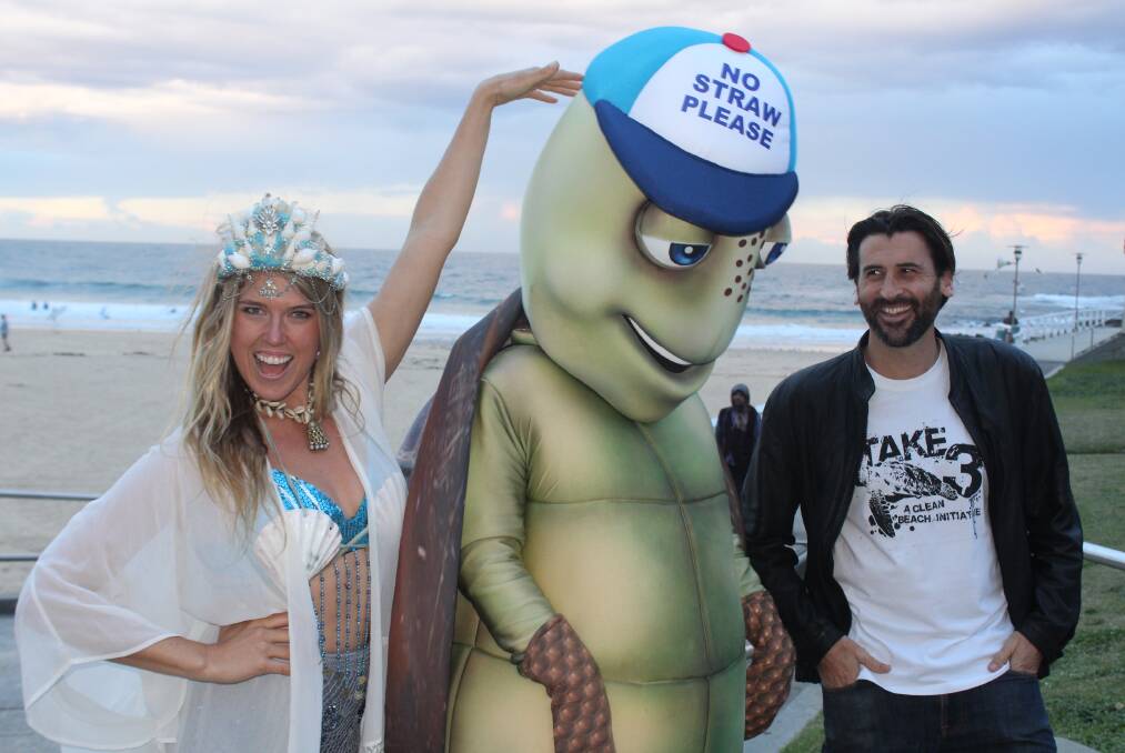 Kate Nelson, Sara Rickards (dressed as anti-plastic turtle 'Tank' for school workshops) and Tim Silverwood at Nobbys Beach.
