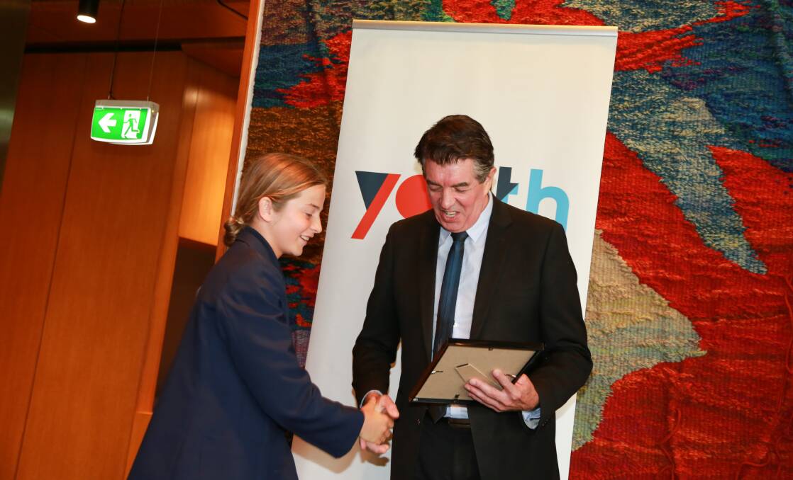 NEW FRONTIER: Flynn Wallace-Smith receives his award from Minster Responsible for Youth, Ray Williams, at Parliament House. Picture: supplied.