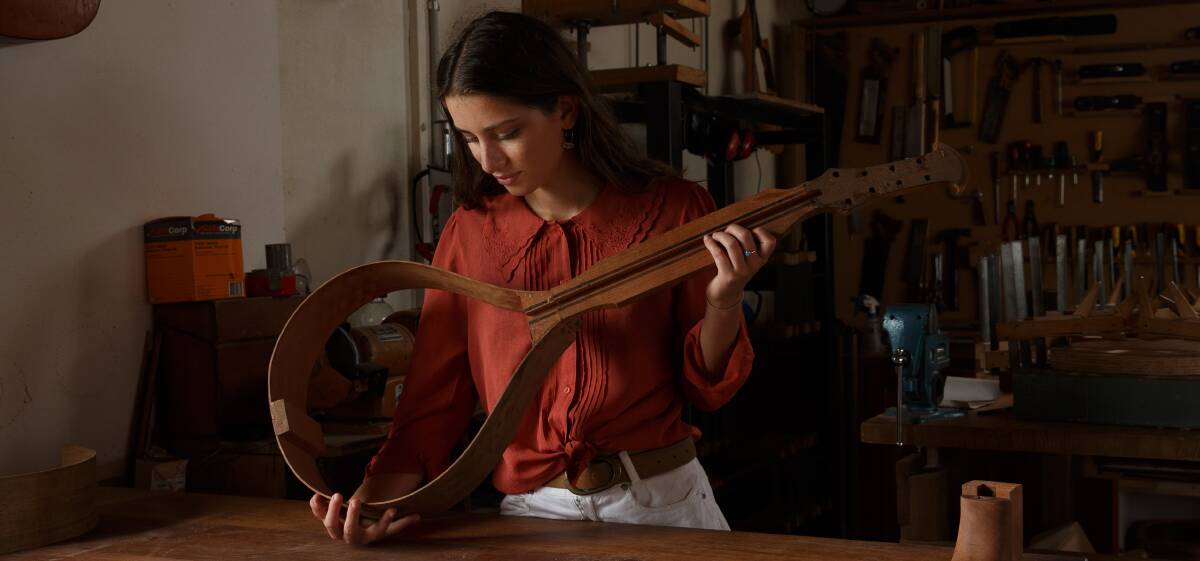 Mae Anagnostis, pictured at the Australian Guitar Making School in Toronto, has been an integral part of all-age music in Newcastle with The Y Project.