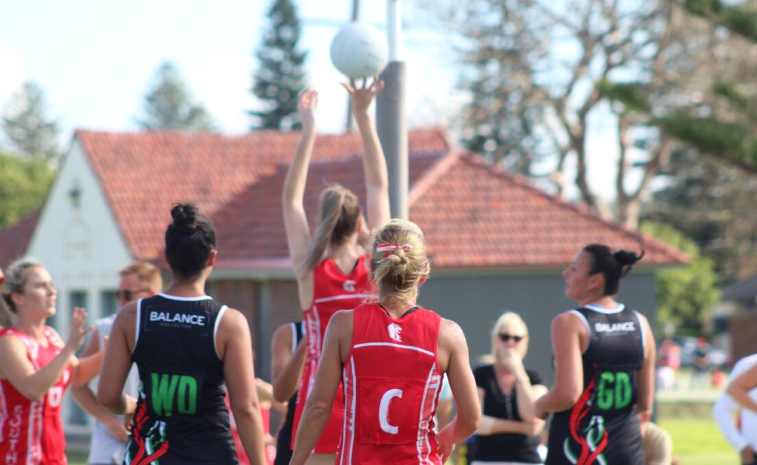 DEBUT BATTLE: West Leagues Balance 2 and Souths Lions players watch on as goal shooter Brooke Fennings slots another home.