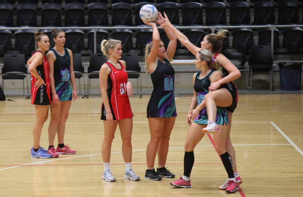 SHOTS: Hunter United's Abbie Gray shot at nearly 80 per cent on Thursday evening, guiding the top grade side to their second win. Katelyn Stansfield and Karlie Robards watch on. Picture: Ngaio Stobbs