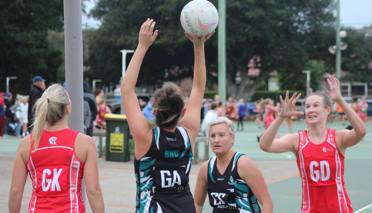 TARGETS: Caitlin Lobston shoots for BNC Whanau in their 2-goal win over second placed Souths, while fellow shooter Samantha Belcher watches on alongside Lions' keeper Georgia McVey and goal defence Jordan Ladwig. Picture: Isaac McIntyre