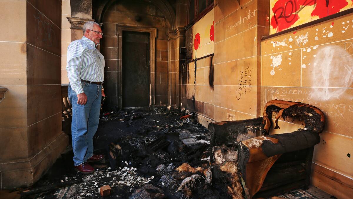 Charred: Awabakal Local Aboriginal Land Council CEO Rob Russell at the post office on Friday morning. Picture: Simone De Peak
