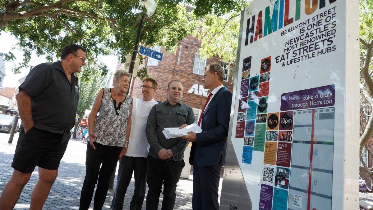 Fed up: Beaumont Street Newsagency owner Robert Burton, Hamilton resident Patricia Mulligan, pharmacist Anthony Piggott and Hamilton Business Chamber president Nathan Errington give the petition to Newcastle MP Tim Crakanthorp. Pictures: Max Mason-Hubers
