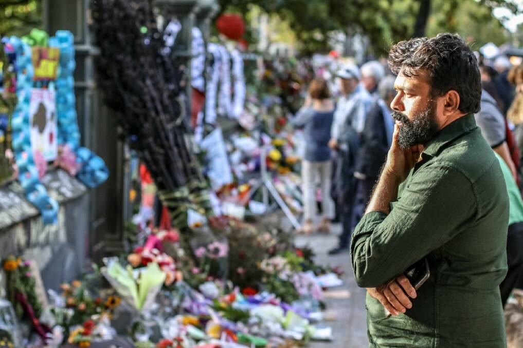 A nation mourns: People gather at a memorial near the Al Noor mosque to pay tribute to the victims of the Christchurch terror attacks. Photo Michael Cummings