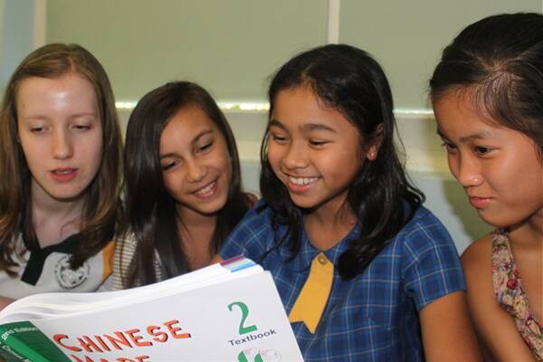 TALK THE TALK: Abigale Slater, Brielle Bellamy, Julianna Sebastian and Olivia Sullivan, at a Hunter Community Chinese Language School class at New Lambton South Public School.
