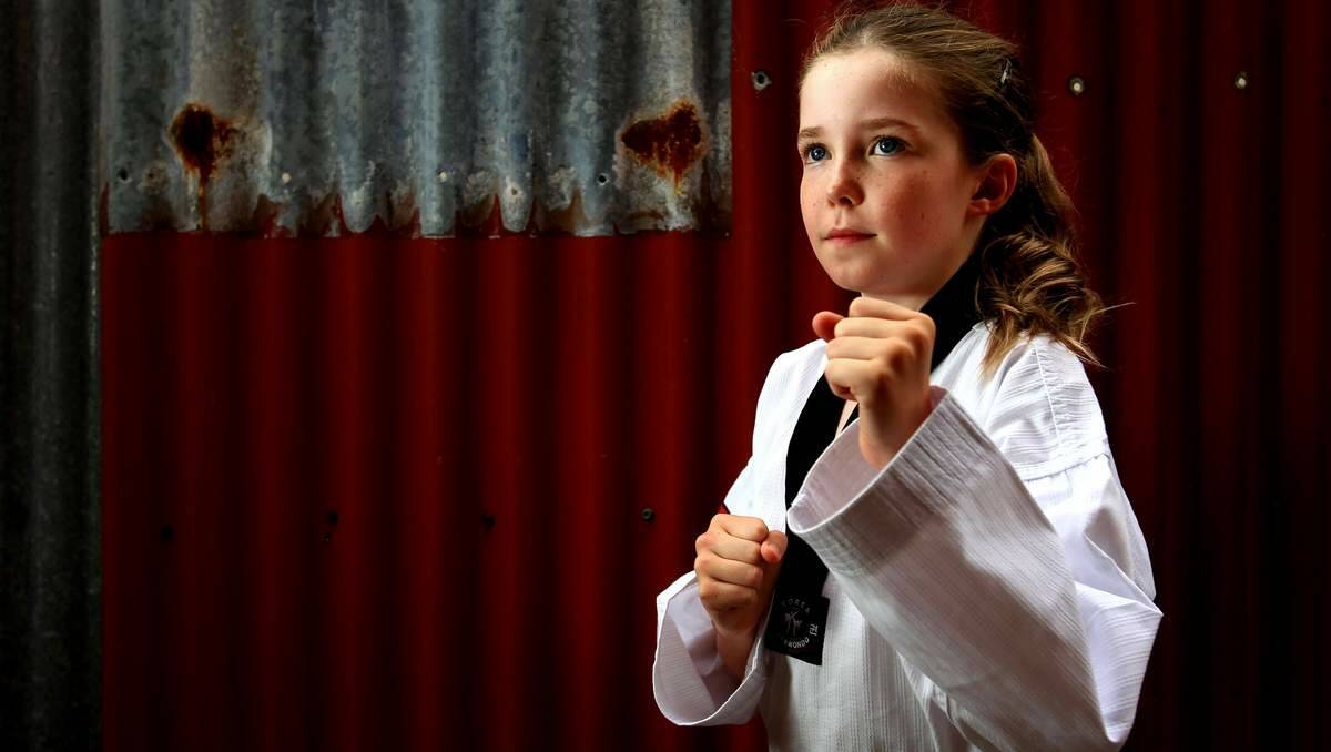 STRONG: Millie Maund has earned her black belt in taekwondo at age 10. Picture: Simone De Peak