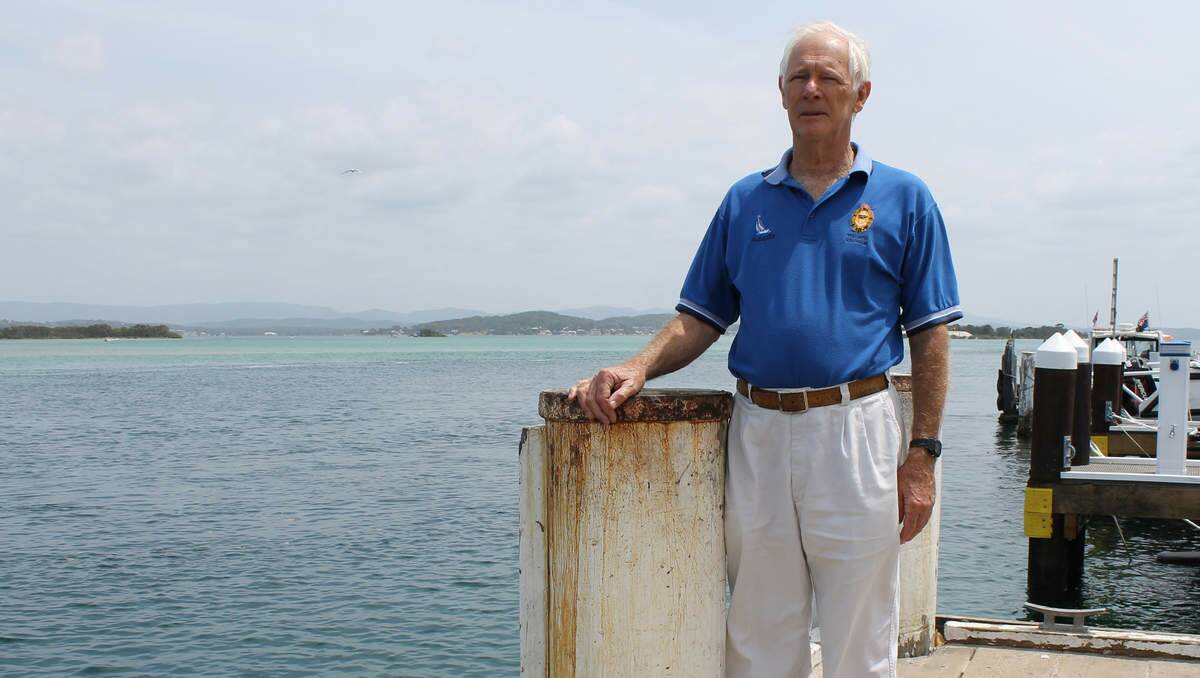 SILT BUILD-UP: Boat Owners’ Association Hunter Region chairman Frank Downing examines the channel from Pelican Marina.