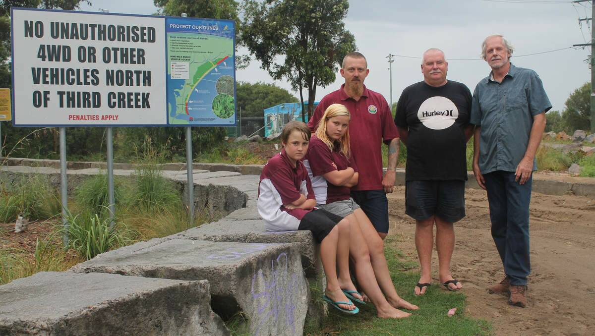 OFF-ROAD ECOLOGISTS: Jake MacLean, 12, with his sister Gemma, 17, and dad Ben, who is also the Raymond Terrace 4WD Club vice-president with Belmont Wetlands State Park Trust members Tony McEnally and Greg Wright at the park’s entrance.