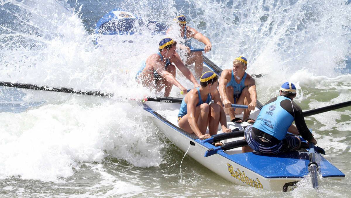 IMPACT: The Redhead under-19s surf boat race team in action at the 2012 Navy Australian Open in Stockton.