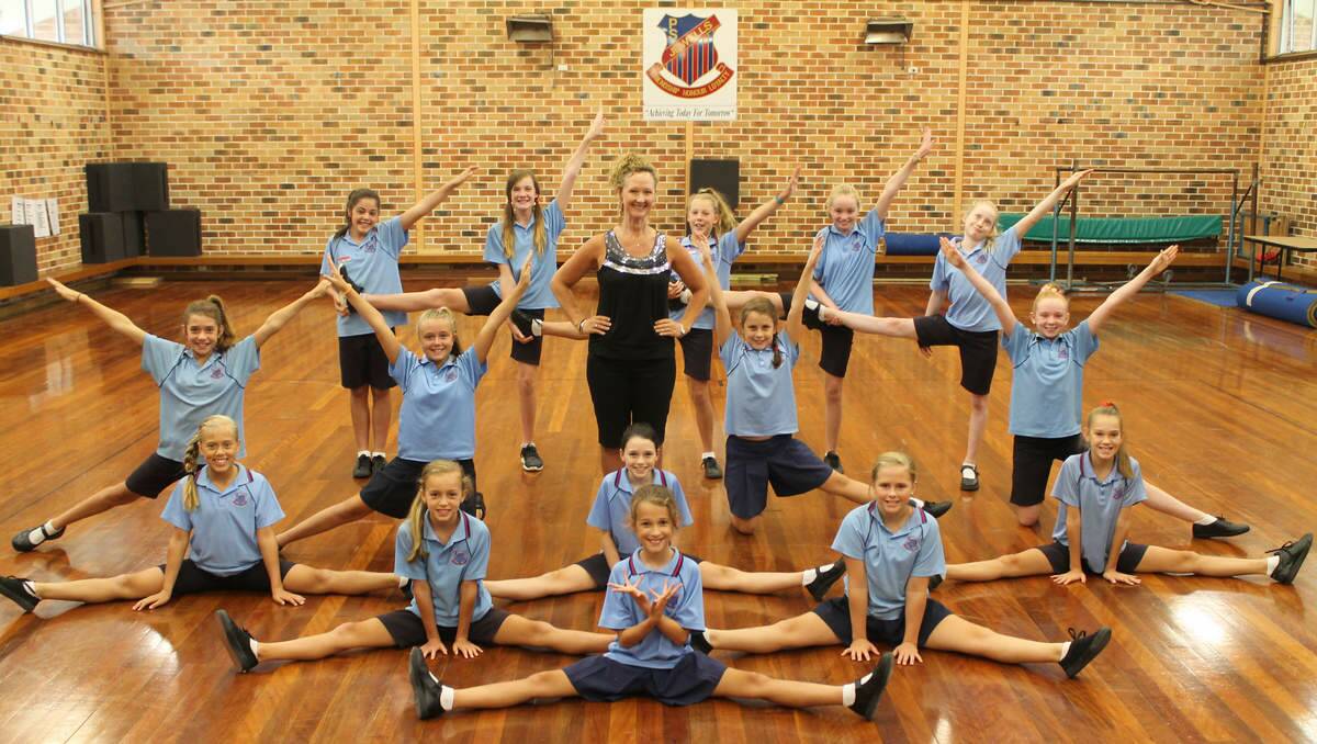 IN SYNC: Jewells Primary School aerobics coach Michelle Yeo with her new squad for 2014.