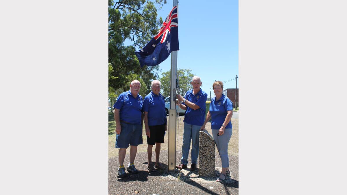 Valentine Lions Bruce Harris, Leon Burwell, president Neville Lambert and secretary Ann Ryan test out the flag ahead of their Australia Day celebrations at Allambee Park, Valentine.
