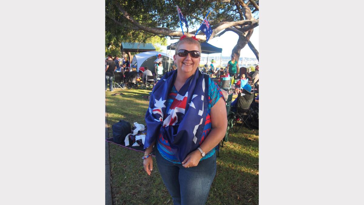 Ann Grimshaw of Cardiff South embracing the flag at the Lake Macquarie Festival, Speers Point on Australia Day.